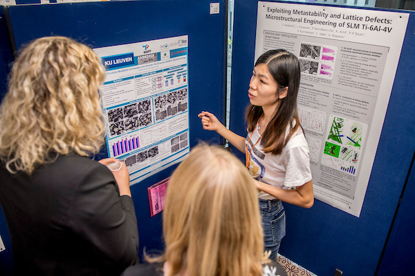 A discussion between three people at the Alloys for Additive Manufacturing Symposium [AAMS2018] poster session - A discussion between three people at the Alloys for Additive Manufacturing Symposium [AAMS2018] poster session