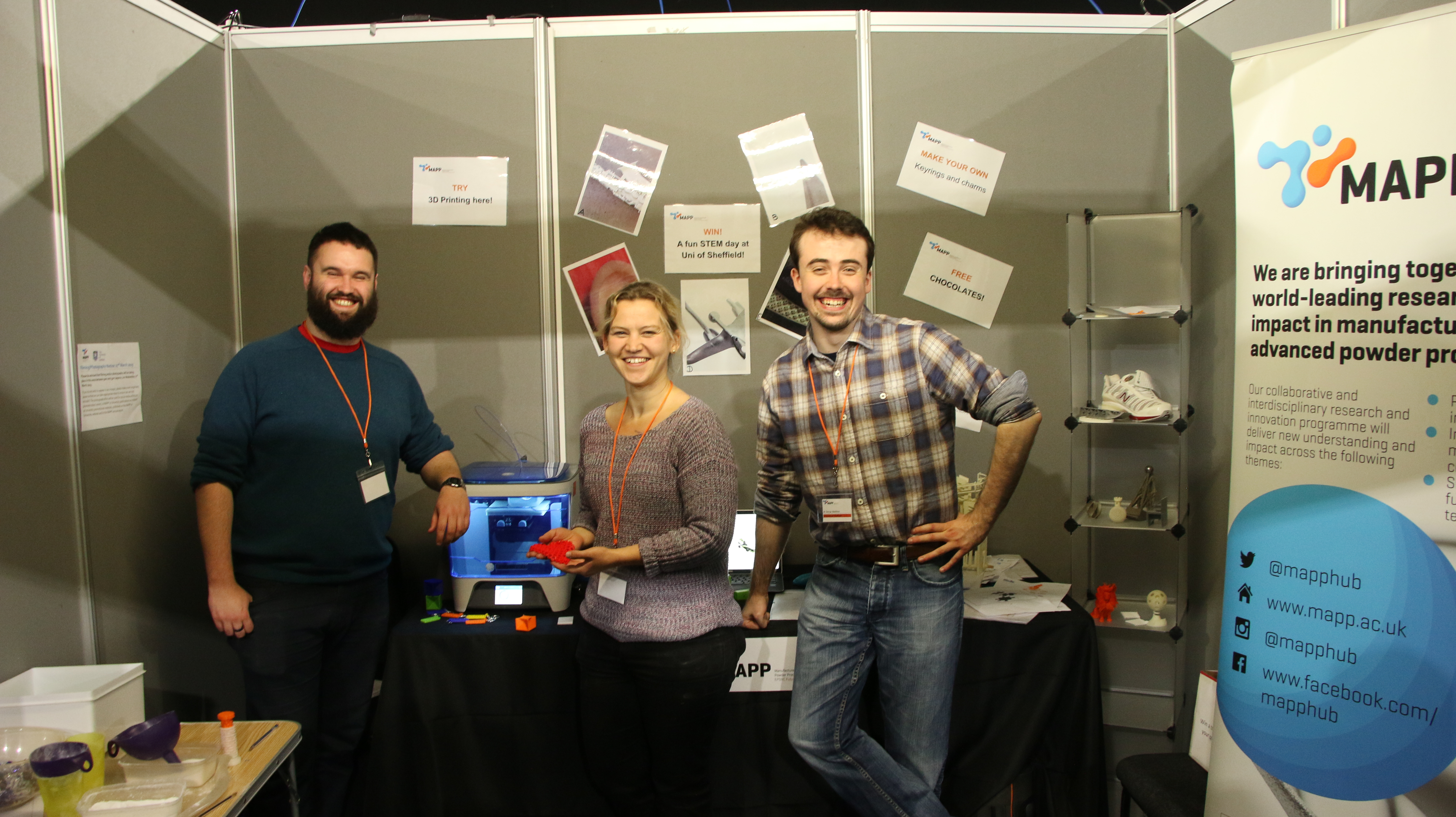 People running the MAPP Get Up To Speed with STEM stand ready to welcome visitors - L to R Thomas Robb, MAPP aligned PhD student, Dr Felicity Freeman, MAPP aligned research associate, George Maddison, MAPP aligned PhD student.