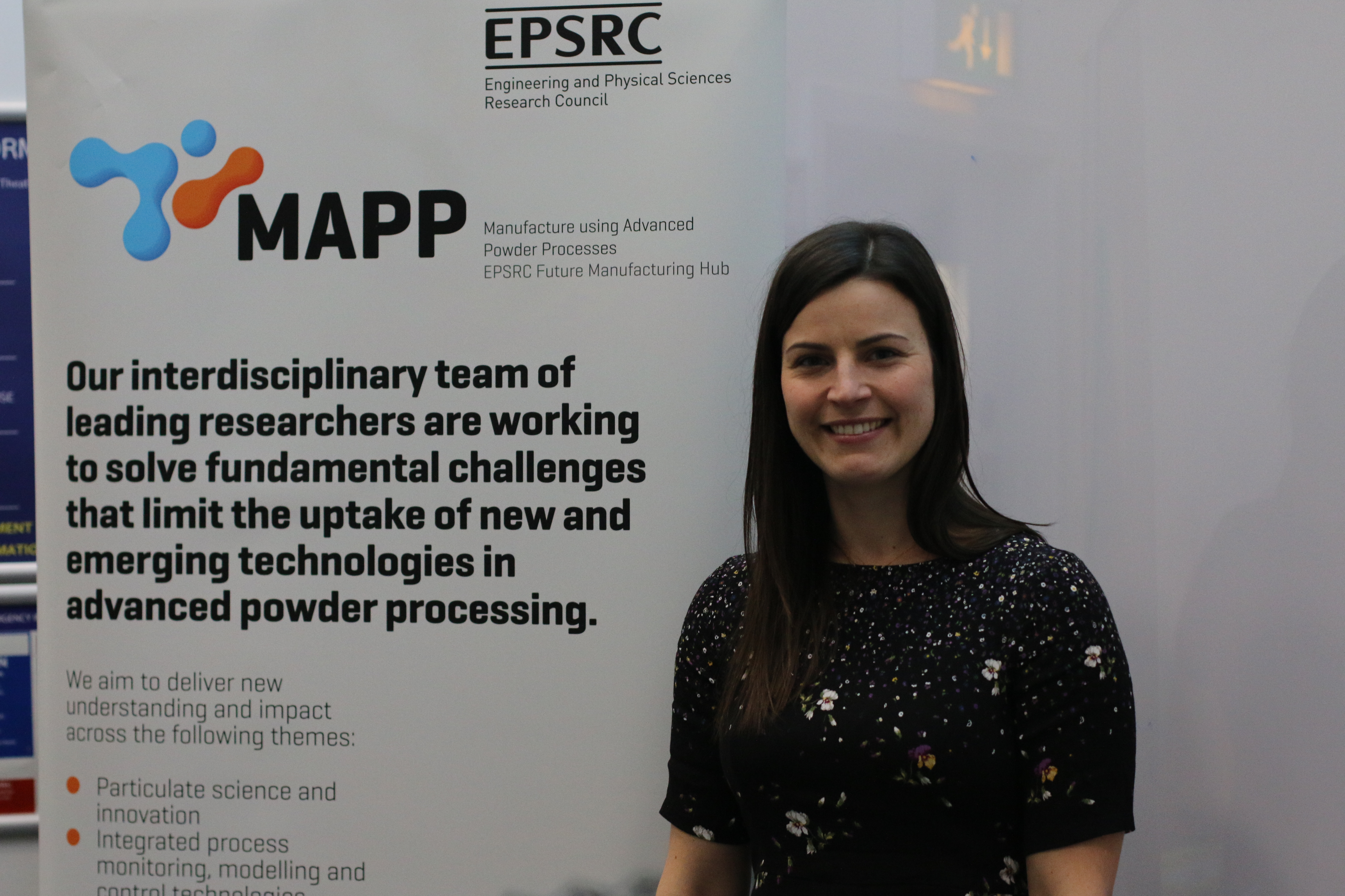 Dr Sarah Everton pictured before speaking at her MAPP Lecture - Dr Sarah Everton pictured in front of a MAPP banner before speaking at her MAPP Lecture