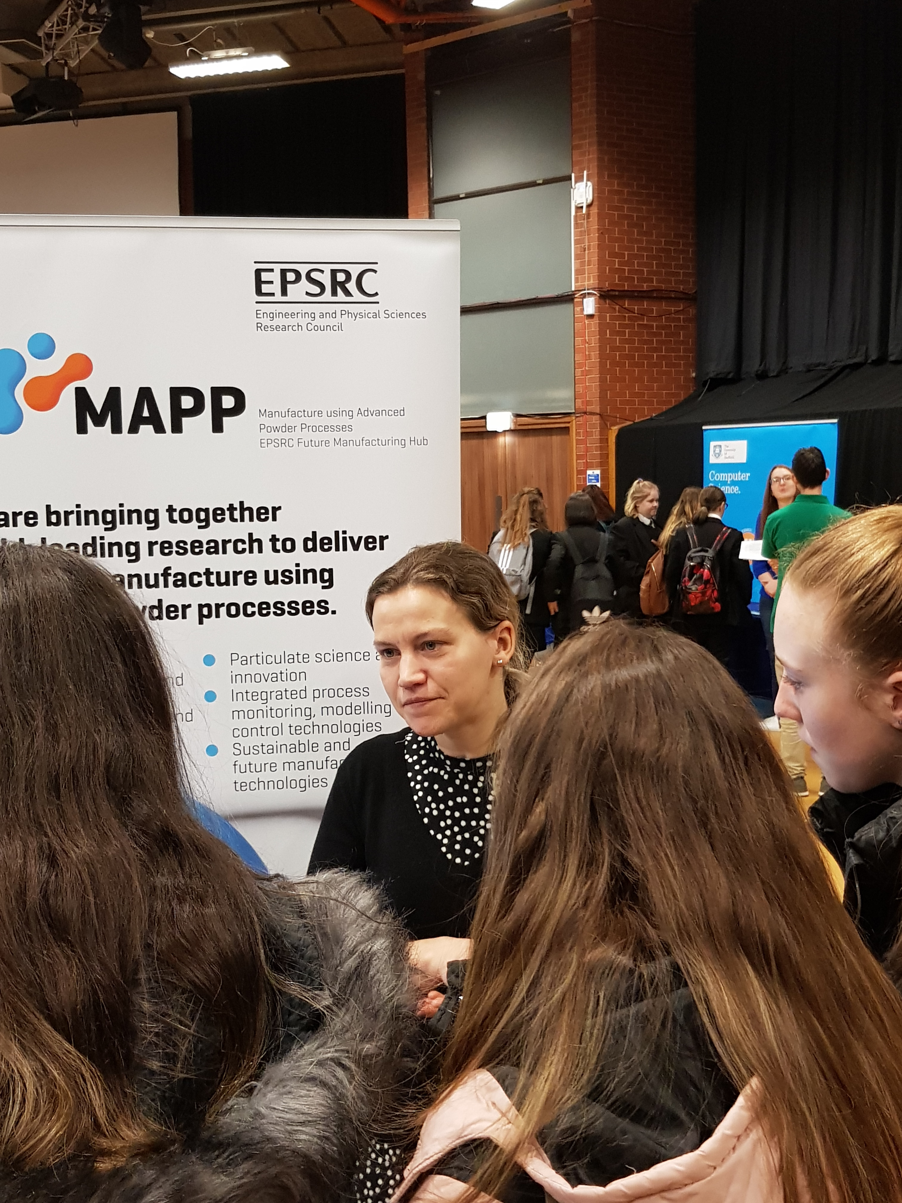Dr Felicity Freeeman speaking to visitors to the MAPP stand at Exploring STEM for Girls - Visitors to the MAPP stand at Exploring STEM for Girls in Sheffield, 2019, discuss additive manufacturing with Dr Felicity Freeeman.